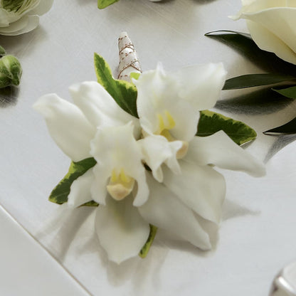 White Mini Cymbidium Boutonniere –  Trail Florist Incorporated, Trail BC